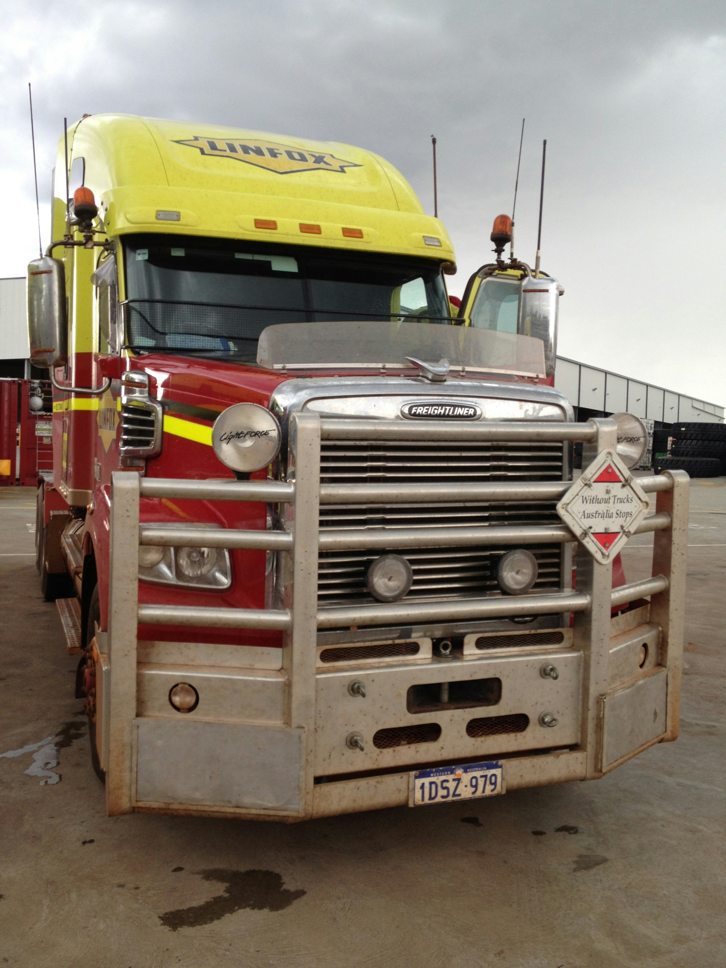 red and yellow Linfux truck